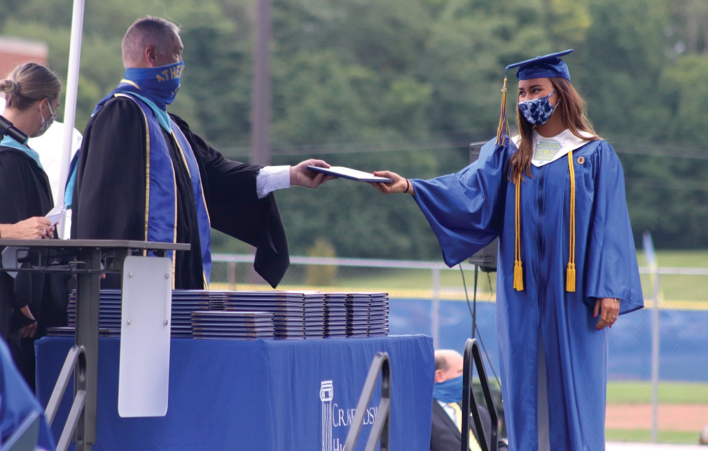 Crawfordsville graduate Abigail Bannon is one of the first to receive her diploma Saturday at Crawfordsville High School. The former Athenian seniors were all handed their eagerly anticipated diplomas from Principal Michael Cox.